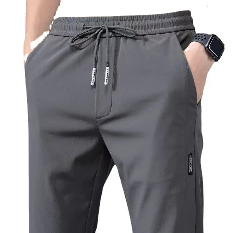 Verão fino casual calças esportivas de seda gelo secagem rápida solta tamanho grande perna reta elástica resistente ao desgaste calças compridas para homem